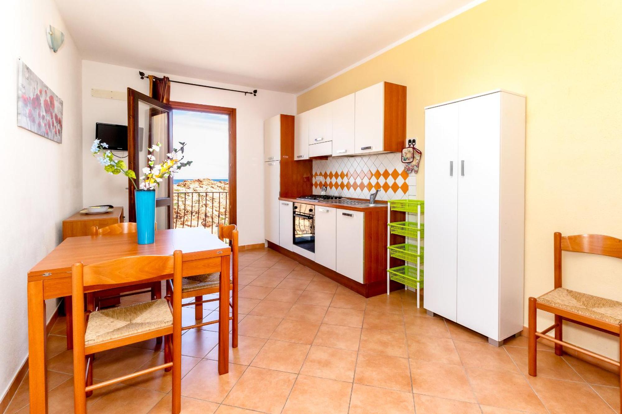 Casa Sulla Scogliera Isola Rossa Apartman Kültér fotó